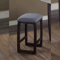 Sgabello da bar altezza bancone con seduta rivestita in lino e base in legno